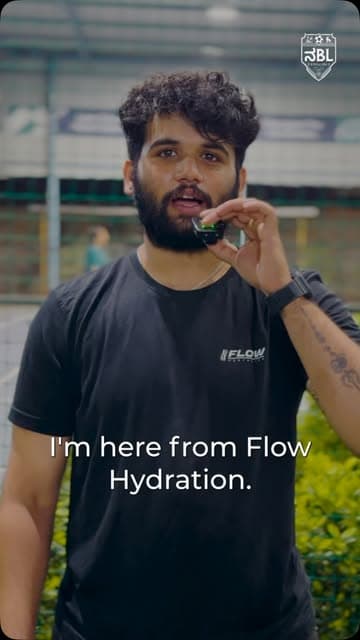Flow team member at a league match